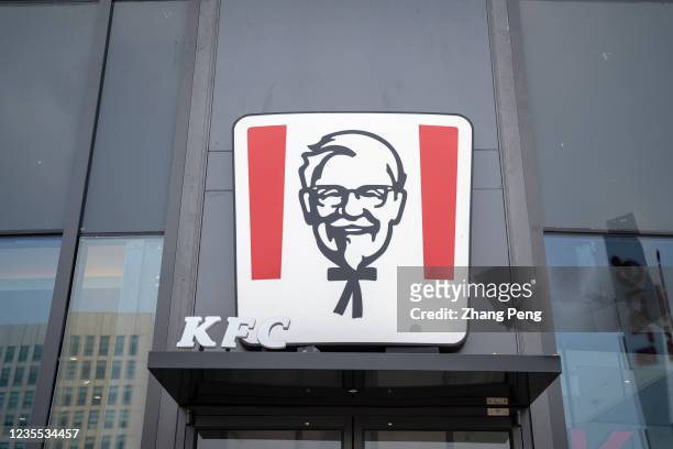 The lightbox logo of Colonel Sanders hangs on the entrance gate of a KFC restaurant. As the demand and consumption have recovered much quicker from...