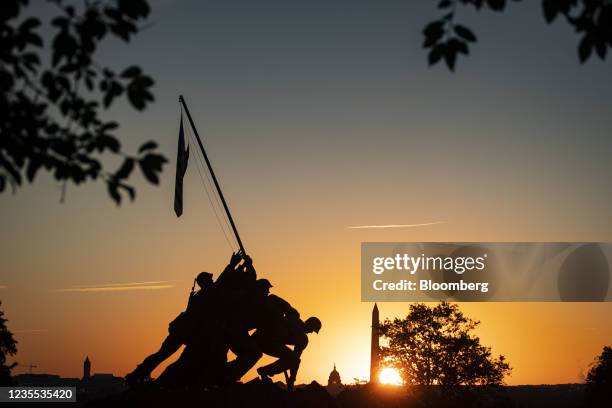 The U.S. Marine Corp's Iwo Jima Memorial in front of the U.S. Capitol, center, and Washington Monument, right, in Arlington, Virginia, U.S., on...