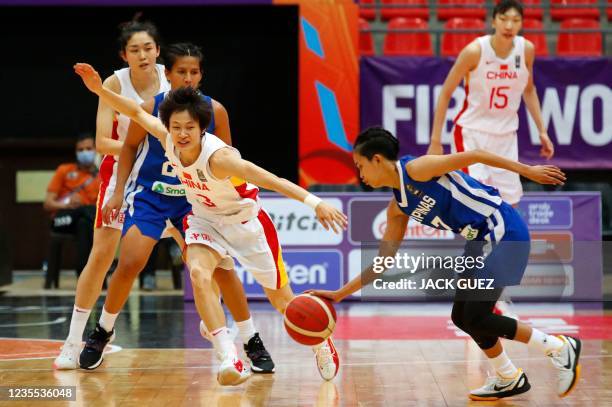 Philippines' shooting guard Janine Pontejos is guarded by China's point guard Yang Liwei during the 2021 FIBA Women's Asia Cup group B basketball...