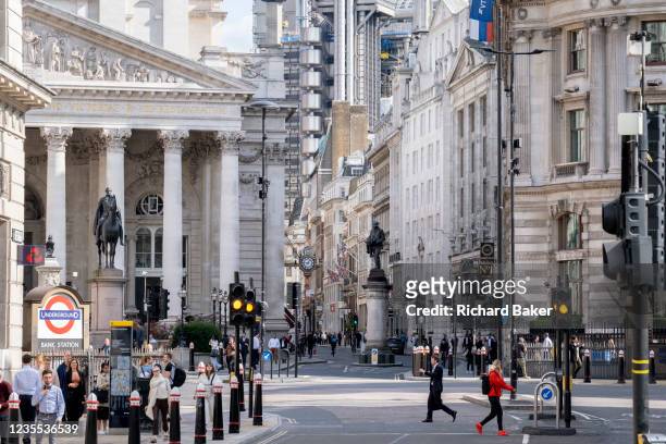 Pedestrians and traffic mingle at Bank junction, in front of Royal Exchange and up Cornhill Street in the City of London, the capital's financial...