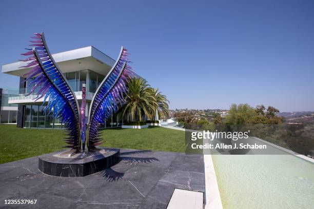 Beverly Hills, CA An exterior view of a sculpture by Simone Cenedese at The One Bel Air, a 105,000-square-foot mansion with a sky deck and putting...