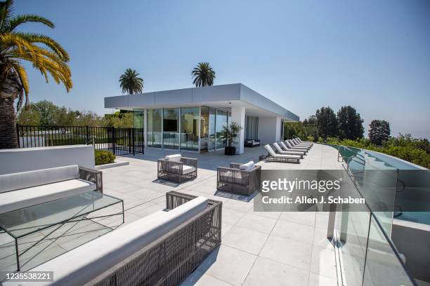 Beverly Hills, CA An exterior view of guest house at The One Bel Air, a 105,000-square-foot mansion with a sky deck and putting green, night club,...