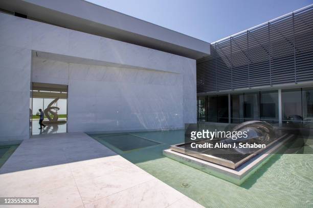 Beverly Hills, CA An exterior view of the main entrance to The One Bel Air, a 105,000-square-foot mansion with a sky deck and putting green, night...