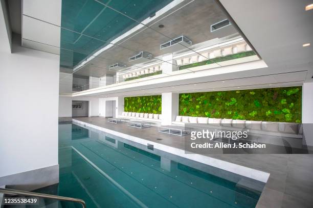 Beverly Hills, CA A view of the indoor pool and living wall at The One Bel Air, a 105,000-square-foot mansion with a sky deck and putting green,...