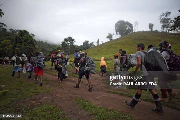 Haitian migrants cross the jungle of the Darien Gap, near Acandi, Choco department, Colombia, heading to Panama, on September 26 on their way trying...