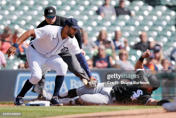 Leury Garcia of the Chicago White Sox is tagged out by third baseman Jeimer Candelario of the Detroit Tigers trying to steal third base during the...