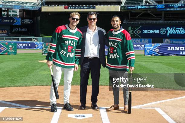 Marcus Foligno, General Manager Bill Guerin, and Matt Dumba of the Minnesota Wild pose for a photo at Target Field on September 27, 2021 in...