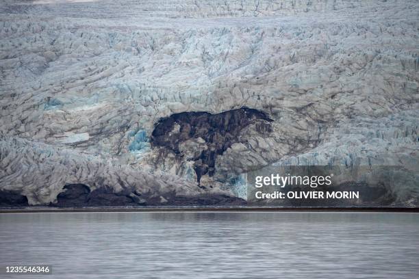 View of Nordenskiold glacier melting and collapsing in the ocean, near Pyramiden, in Svalbard, a northern Norwegian archipelago on September 21, 2021.