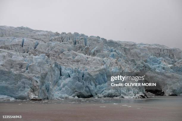 View of Nordenskiold glacier melting and collapsing in the ocean, near Pyramiden, in Svalbard, a northern Norwegian archipelago on September 22, 2021.