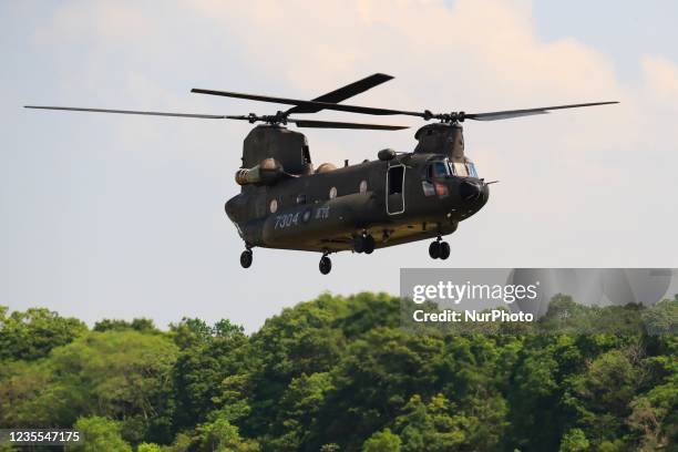 Chinook Helicopter flies over a military camp, as part of a rehearsal for the flyby performance for Taiwans Double-Ten National Day Celebration, amid...