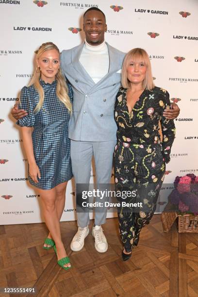 Georgia Hirst, Dr Emeka Okorocha and Mika Simmons attend the 7th annual Lady Garden Foundation lunch at Fortnum & Mason on September 28, 2021 in...