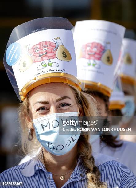 Medical staff members participate in a protest for better working conditions at Leiden University Medical Center on september 28, 2021. - -...