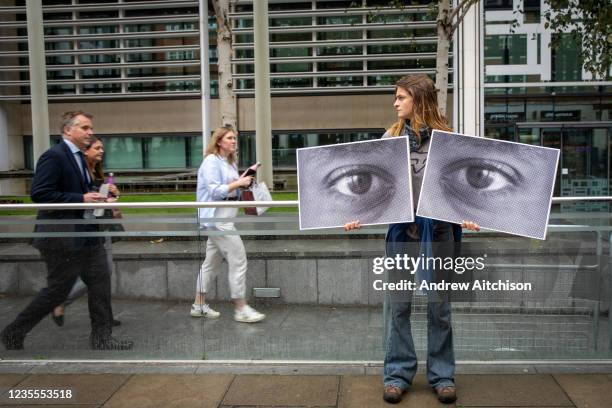 Campaigner holding up watching eyes for a Close Napier Barracks demonstration outside the Home Office headquarters on Marsham street on the 28th...