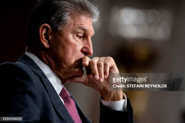 Senator Joe Manchin listens during a Senate Armed Services Committee on Afghanistan, in the Dirksen Senate Office Building on Capitol Hill in...