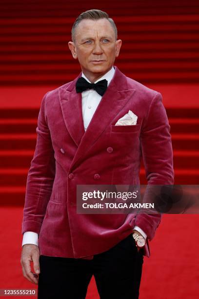 English actor Daniel Craig poses on the red carpet after arriving to attend the World Premiere of the James Bond 007 film "No Time to Die" at the...