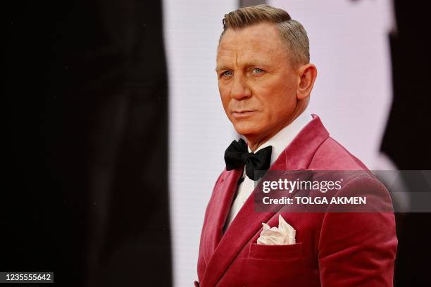 English actor Daniel Craig poses on the red carpet after arriving to attend the World Premiere of the James Bond 007 film "No Time to Die" at the...