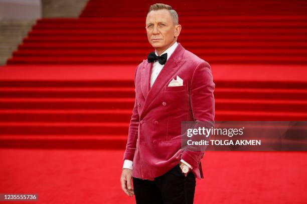 English actor Daniel Craig poses on the red carpet after arriving to attend the World Premiere of the James Bond 007 film "No Time to Die" at the...
