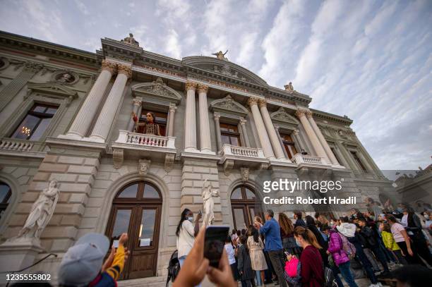 Little Amal", a 3.5 meter tall puppet greets fans from the first floor of the Grand Theatre de Geneve on September 28, 2021 in Geneva, Switzerland....
