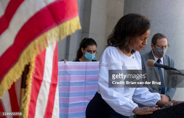 Los Angeles, CA - September 11,2021: Capri Maddox, executive director of the Los Angeles Department of Civil and Human Rights, center, prays during a...