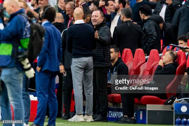 Head coach Erik ten Hag of Ajax Amsterdam and head coach Sergen Yalcin of Besiktas JK talk to each other prior to the UEFA Champions League group C...