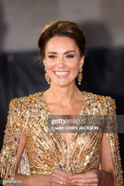Britain's Catherine, Duchess of Cambridge reacts as she arrives ahead of the World Premiere of the James Bond 007 film "No Time to Die" at the Royal...