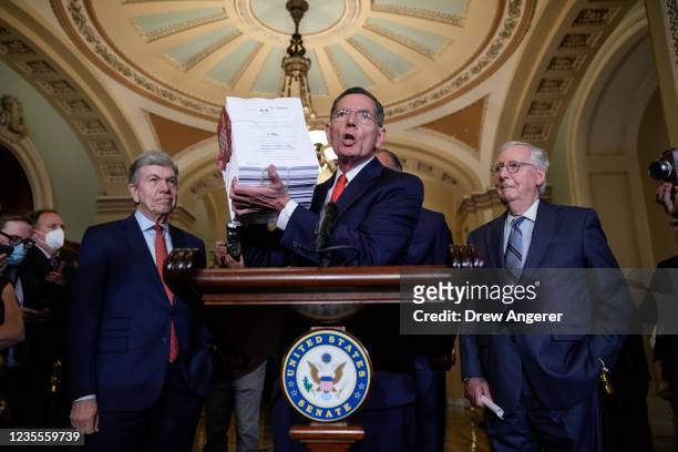 Flanked by Sen. Roy Blunt and Senate Minority Leader Mitch McConnell , Sen. John Barrasso holds up a visual aide to represent the Democrats' $3.5...