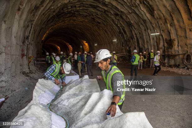 Engineers work on a model of the under construction Zojila tunnel which will connect Kashmir with Ladakh union territories, on September 28, 2021 in...