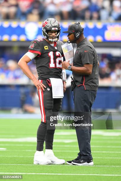 Tampa Bay Buccaneers quarterback Tom Brady talks with offensive coordinator Byron Leftwich during the NFL game between the Tampa Bay Buccaneers and...