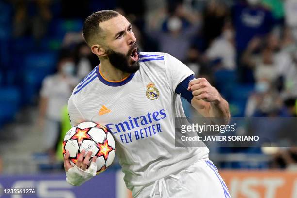 Real Madrid's French forward Karim Benzema celebrates his goal during the UEFA Champions League first round group D footbal match between Real Madrid...