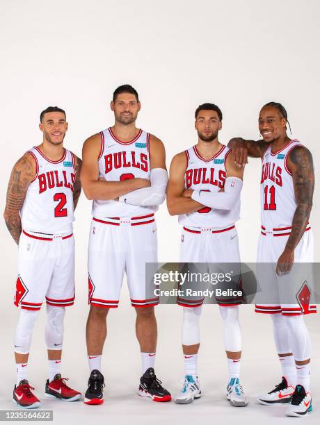 Lonzo Ball, Nikola Vucevic, Zach LaVine, and DeMar DeRozan of the Chicago Bulls pose for a portrait during NBA Media Day on September 27, 2021 at the...