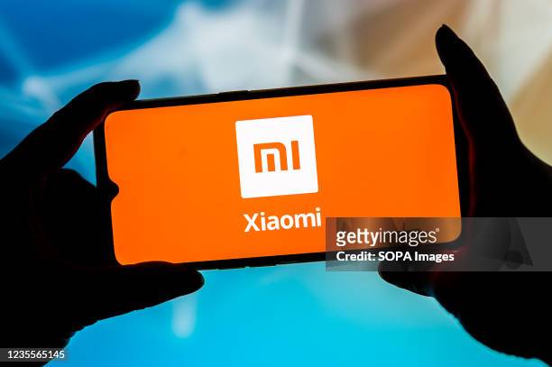 In this photo illustration, a Xiaomi logo seen displayed on a smartphone.