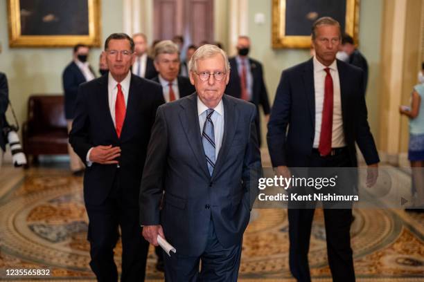 Senate Minority Leader Mitch McConnell followed by other members of Republican leadership walk to a news conference following a policy luncheon at...