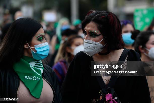 Two women speak during a Pro-Choice protest called 'Maternar, abortar, decidir y luchar en comunidad' on September 28, 2021 in Quito, Ecuador. The...