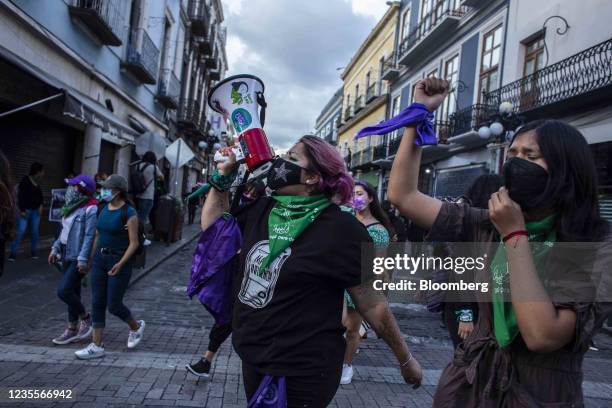 Demonstrators march on a street during a rally for the decriminalization of abortions in Puebla, Mexico, on Tuesday, Sept. 28, 2021. Mexicos Supreme...