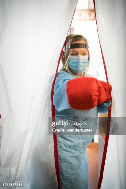 frontline workers ready to fight covid-19 - fight covid stock pictures, royalty-free photos & images