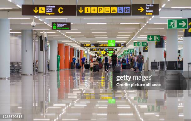 September 2021, Spain, Palma De Mallorca: Passengers pass through the airport. Aeropuerto de Son San Juan Airport is one of three international...