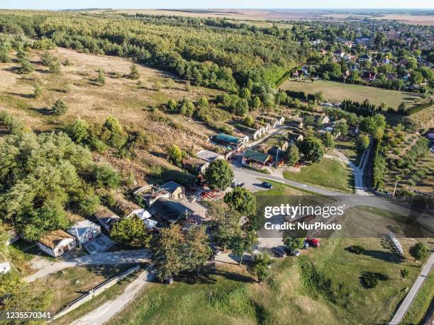 Wine cellars at the hill on the outskirts of the village are seen in Bogacs, Hungary on 25 September 2021 Bogacs wine cellars is a place where people...