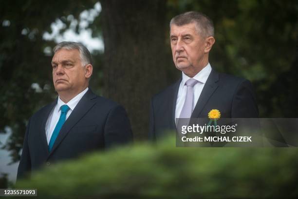 Czech Prime Minister Andrej Babis and his Hungarian counterpart Viktor Orban review a guard of honour during a welcome ceremony on September 29, 2021...