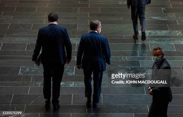 Germany's conservative Christian Democratic Union leader and candidate for Chancellor Armin Laschet leaves after a meeting in the Bundestag compound...
