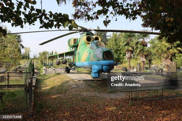 Mi-24 Soviet attack helicopter placed nearby the grave of colonel pilot Jimi Maisuradze who died in the helicopter fell after a rocket attack during...