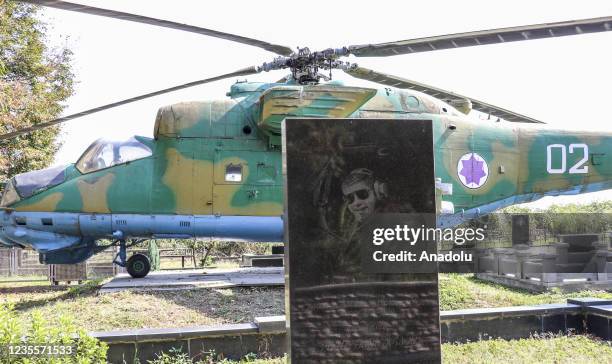 Mi-24 Soviet attack helicopter placed nearby the grave of colonel pilot Jimi Maisuradze who died in the helicopter fell after a rocket attack during...