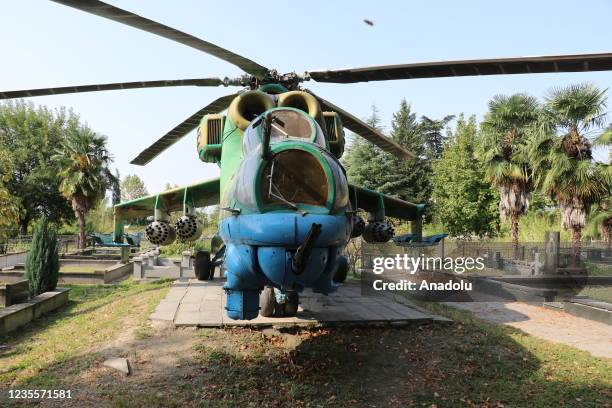 Mi-24 Soviet attack helicopter placed nearby the grave of colonel pilot Jimi Maisuradze who died in the helicopter fell after a rocket attack during...