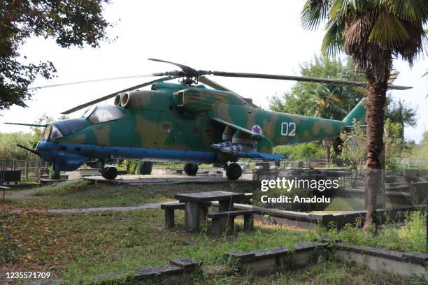 Mi-24 Soviet attack helicopter placed nearby the grave of colonel pilot Jimi Maisuradze who died in the helicopter fell after a rocket attack during...