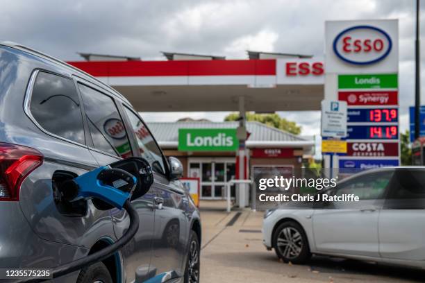 An electric car charges at a Motor Fuel Group station whilst petrol and diesel pumps are closed on the Esso forecourt due to the ongoing fuel crisis...