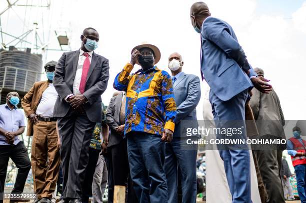 Kenya's former Prime Minister and opposition leader Raila Odinga arrives for the inauguration of Kibra Level 3 hospital in Kibera slum in Nairobi on...