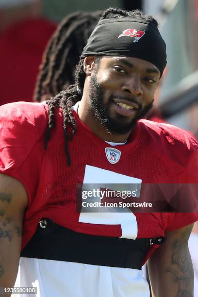 Newly signed Tampa Bay Buccaneers defensive back Richard Sherman smiles during the Tampa Bay Buccaneers work out on September 29, 2021 at the...