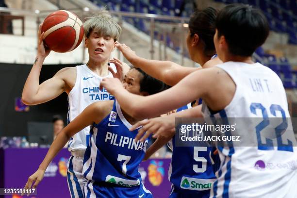 Taiwan's guard Yu-Ting Lin goes for a lay-up against Philippines's shooting guard Janine Pontejos during the 2021 FIBA Women's Asia Cup group B...