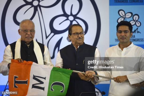 Trinamool Congress General Secretary Abhishek Banerjee hands over party flag to former Congress leader and Goa chief minister Luizinho Faleiro as he...