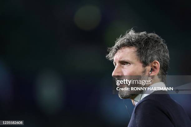 Wolfsburg's Dutch head coach Mark van Bommel looks on prior the UEFA Champions League Group G football match between VfL Wolfsburg and Sevilla FC in...