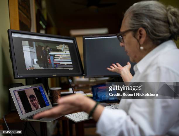Associate Professor Carol Dysinger, right, of New York University's Tisch School of the Arts, conducts her final remote office hour for the graduate...